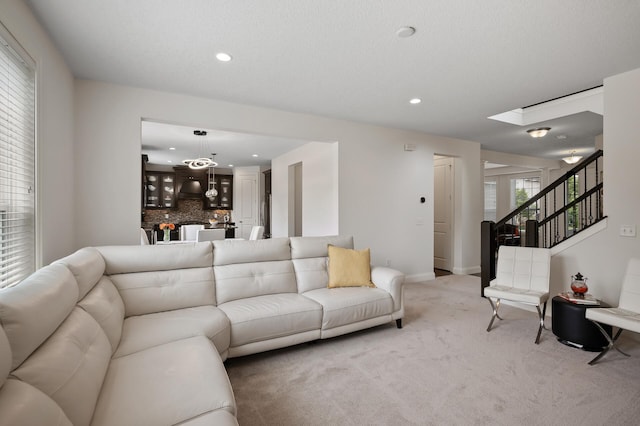 18301 100th Ave N, Maple Grove, MN 55311 - living room with light colored carpet, recessed lighting, stairway, and a skylight