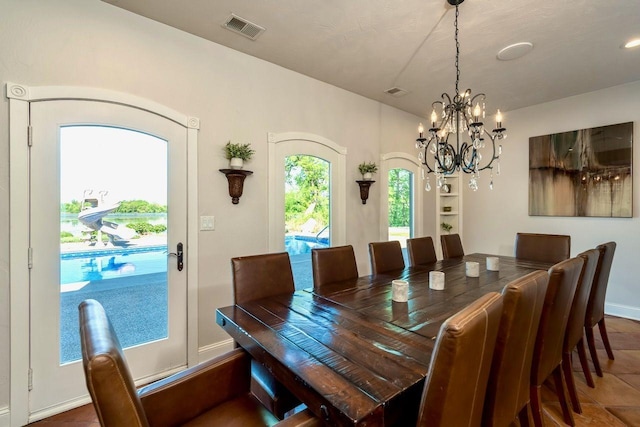 24534 474th Ln, Elysian Twp, MN 56028 - dining space featuring a chandelier and baseboards