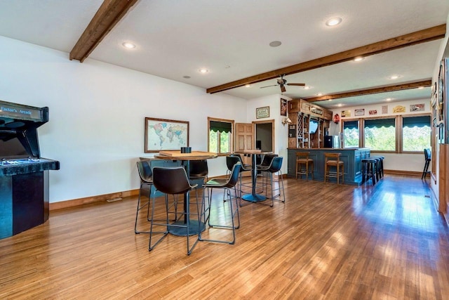24534 474th Ln, Elysian Twp, MN 56028 - kitchen with baseboards, beamed ceiling, wood finished floors, recessed lighting, and ceiling fan