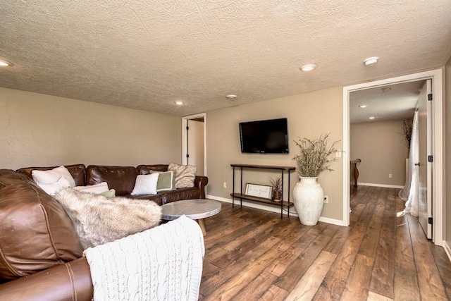 24534 474th Ln, Elysian Twp, MN 56028 - living area with hardwood / wood-style floors, a textured ceiling, baseboards, and recessed lighting