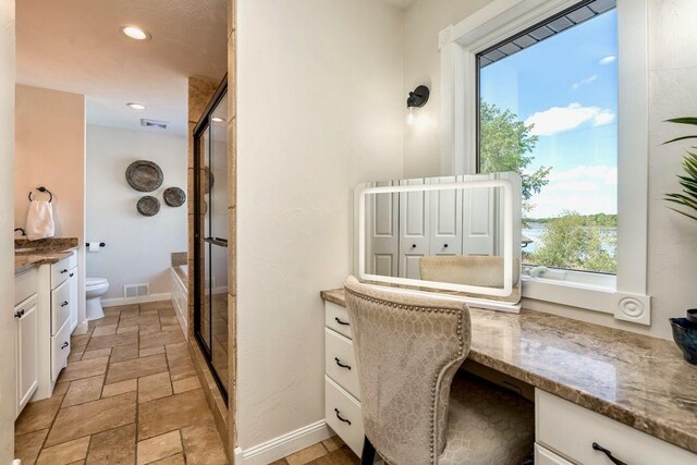 24534 474th Ln, Elysian Twp, MN 56028 - home office with built in desk, stone tile flooring, baseboards, and recessed lighting