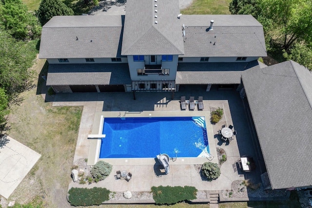 24534 474th Ln, Elysian Twp, MN 56028 - outdoor pool with a diving board and a patio