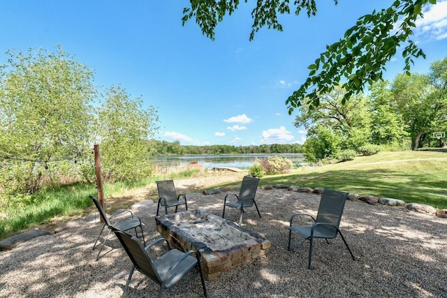 24534 474th Ln, Elysian Twp, MN 56028 - view of patio with a water view and a fire pit