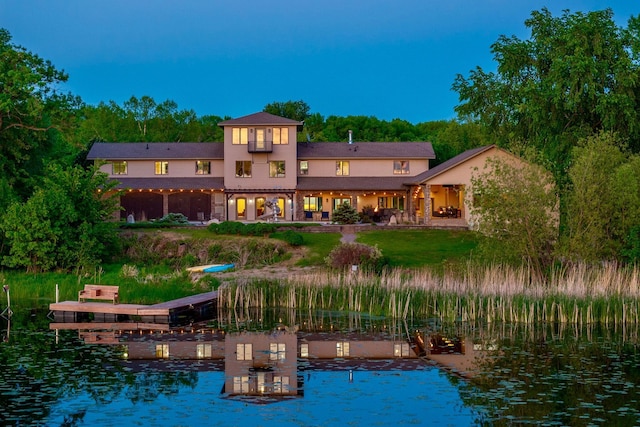 24534 474th Ln, Elysian Twp, MN 56028 - back of house featuring a water view and stucco siding