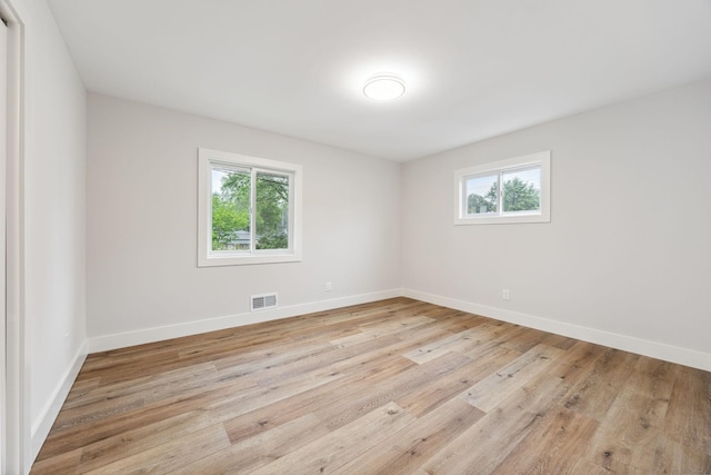 3936 Quail Ave N, Robbinsdale, MN 55422 - spare room with plenty of natural light, light wood finished floors, and baseboards
