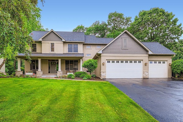 946 Wild Rose Ct, Eagan, MN 55123 - view of front of property with stucco siding, driveway, a front lawn, and covered porch