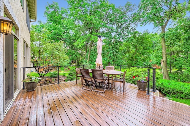 946 Wild Rose Ct, Eagan, MN 55123 - wooden deck with view of wooded area and outdoor dining space