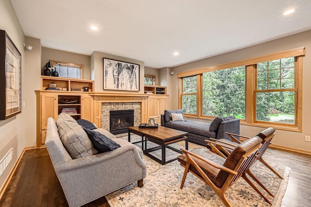 946 Wild Rose Ct, Eagan, MN 55123 - living room featuring wood finished floors, a glass covered fireplace, and recessed lighting