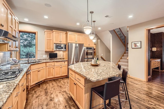 946 Wild Rose Ct, Eagan, MN 55123 - kitchen featuring light brown cabinets, stainless steel appliances, wood finished floors, and recessed lighting