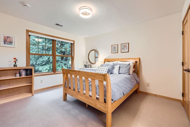 946 Wild Rose Ct, Eagan, MN 55123 - bedroom with light colored carpet and a textured ceiling