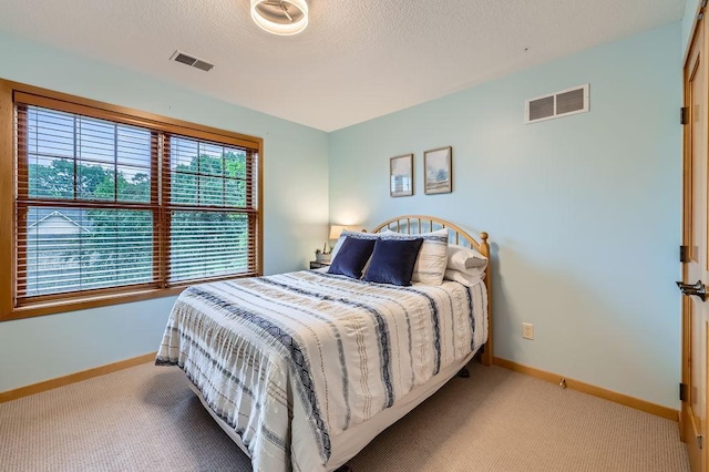 946 Wild Rose Ct, Eagan, MN 55123 - carpeted bedroom featuring baseboards and a textured ceiling