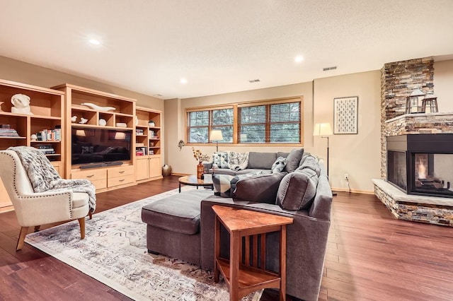 946 Wild Rose Ct, Eagan, MN 55123 - living room featuring a stone fireplace, wood finished floors, and recessed lighting
