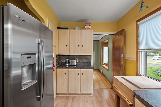 967 Stryker Ave W, Saint Paul, MN 55118 - kitchen featuring stainless steel refrigerator with ice dispenser, light brown cabinetry, and plenty of natural light