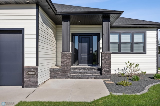 2800 Mcleod Dr E, West Fargo, ND 58078 - view of exterior entry with roof with shingles