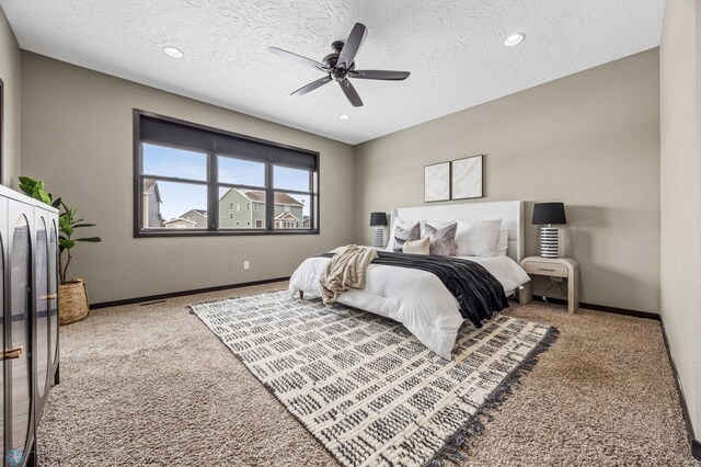 2800 Mcleod Dr E, West Fargo, ND 58078 - carpeted bedroom with a textured ceiling, baseboards, recessed lighting, and ceiling fan