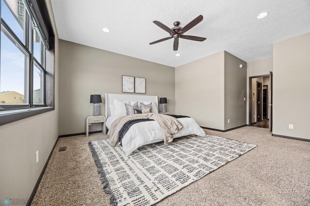 2800 Mcleod Dr E, West Fargo, ND 58078 - carpeted bedroom featuring baseboards, recessed lighting, ceiling fan, and a textured ceiling