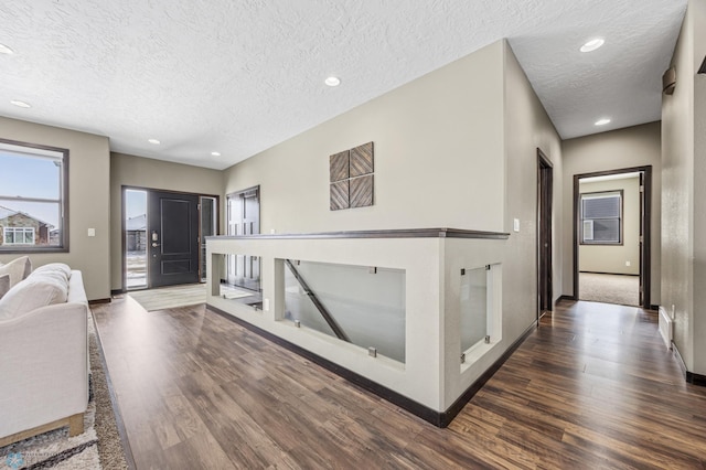 2800 Mcleod Dr E, West Fargo, ND 58078 - corridor featuring wood finished floors, a textured ceiling, baseboards, and recessed lighting