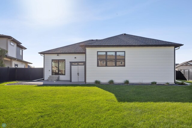 2800 Mcleod Dr E, West Fargo, ND 58078 - rear view of property with a patio area and a shingled roof