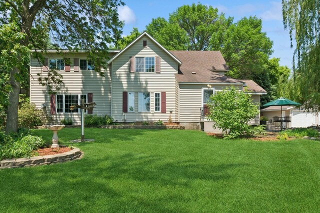 6198 210th Ave SE, Lake Lillian Twp, MN 56253 - back of house featuring a yard and a shingled roof