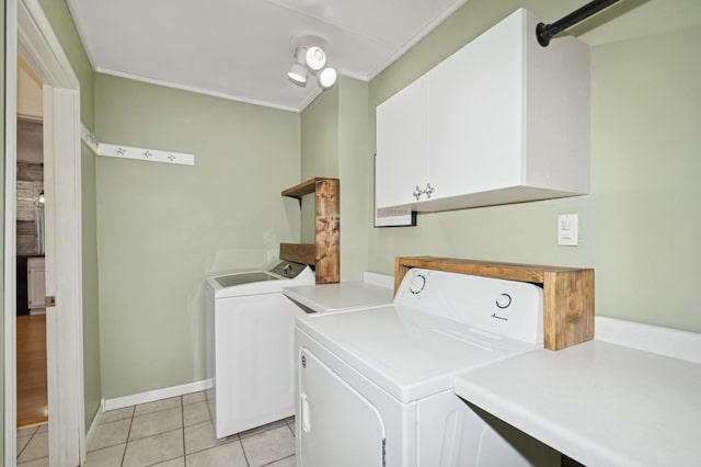 6198 210th Ave SE, Lake Lillian Twp, MN 56253 - washroom with washing machine and clothes dryer, cabinet space, light tile patterned flooring, ornamental molding, and baseboards