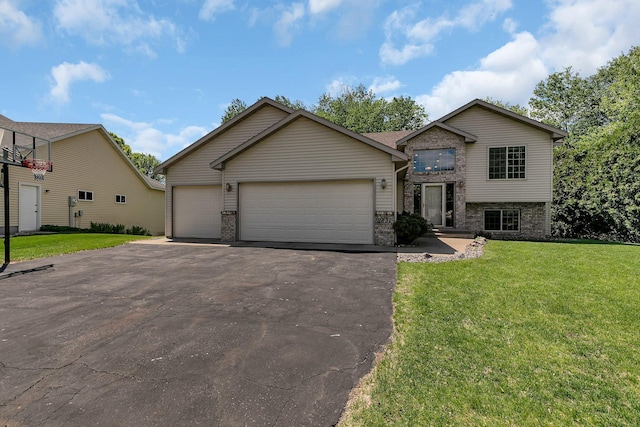 2821 15th Ave S, Saint Cloud, MN 56301 - view of front of property featuring brick siding, asphalt driveway, a front yard, and an attached garage