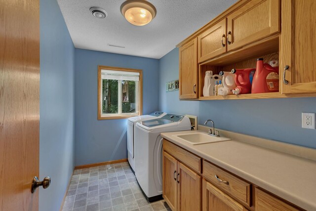 2821 15th Ave S, Saint Cloud, MN 56301 - laundry area with washing machine and dryer, cabinet space, and baseboards
