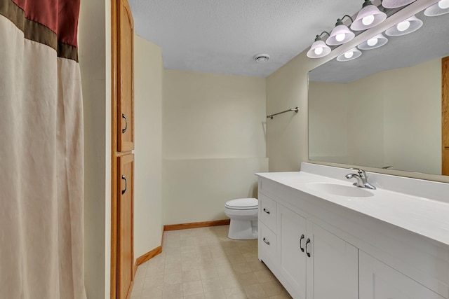 2821 15th Ave S, Saint Cloud, MN 56301 - bathroom with vanity, toilet, baseboards, and a textured ceiling