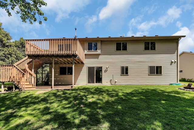 2821 15th Ave S, Saint Cloud, MN 56301 - rear view of house with a deck, a yard, and stairway