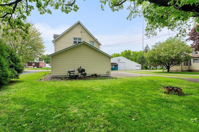 208 2nd St SW, Braham, MN 55006 - view of property exterior featuring a lawn and a garage