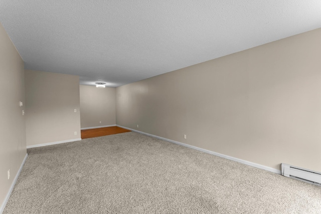 179 Little Canada Rd E Unit 230, Little Canada, MN 55117 - unfurnished room featuring carpet flooring, baseboards, a textured ceiling, and a baseboard radiator