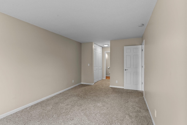 179 Little Canada Rd E Unit 230, Little Canada, MN 55117 - unfurnished bedroom with carpet, baseboards, and a closet