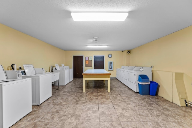 179 Little Canada Rd E Unit 230, Little Canada, MN 55117 - community laundry room featuring washing machine and clothes dryer and a textured ceiling
