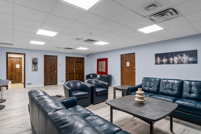 179 Little Canada Rd E Unit 230, Little Canada, MN 55117 - living room with a paneled ceiling, light wood-style flooring, and baseboards
