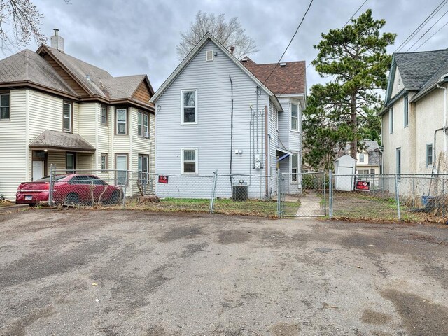 818 Edmund Ave, Saint Paul, MN 55104 - rear view of property with a gate and cooling unit