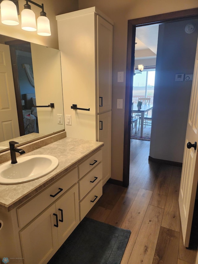 1743 46th Ave S, Moorhead, MN 56560 - bathroom featuring wood-type flooring and vanity