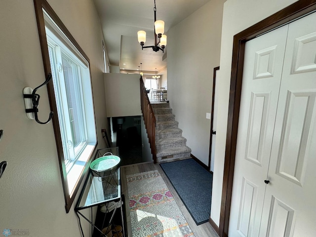 1743 46th Ave S, Moorhead, MN 56560 - entryway with a chandelier, stairs, and baseboards