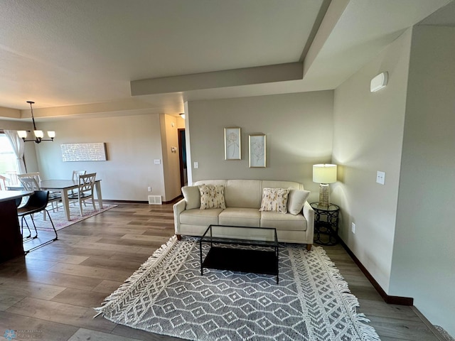 1743 46th Ave S, Moorhead, MN 56560 - living area with wood finished floors, baseboards, and a chandelier