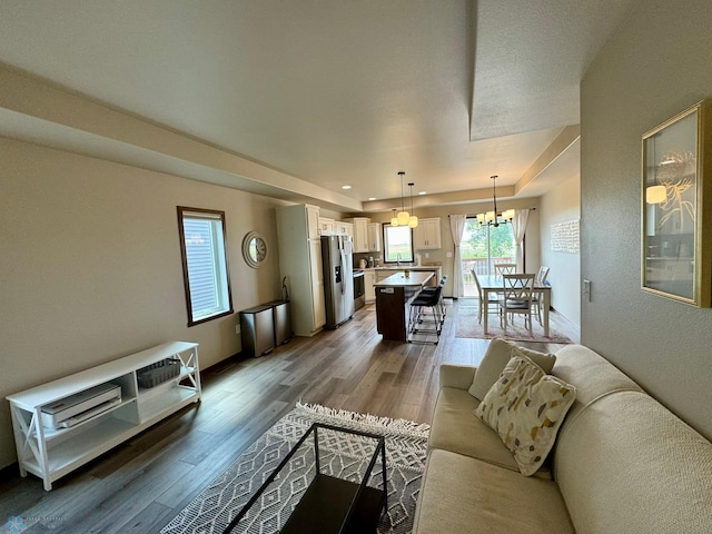 1743 46th Ave S, Moorhead, MN 56560 - living room with light wood-style floors, a chandelier, baseboards, and recessed lighting