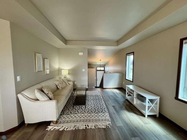 1743 46th Ave S, Moorhead, MN 56560 - living room featuring wood finished floors, a tray ceiling, and baseboards