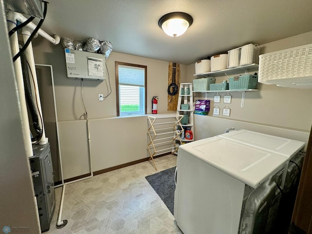 1743 46th Ave S, Moorhead, MN 56560 - laundry area featuring washing machine and clothes dryer, light floors, and baseboards