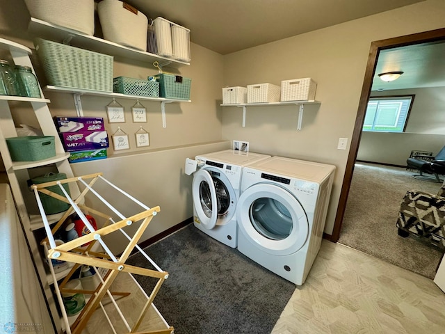 1743 46th Ave S, Moorhead, MN 56560 - laundry room with washing machine and dryer, baseboards, and light colored carpet