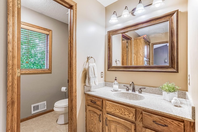 38 Jefferson Ct, Hastings, MN 55033 - half bath featuring toilet, vanity, baseboards, and tile patterned floors