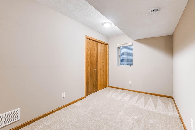 38 Jefferson Ct, Hastings, MN 55033 - unfurnished bedroom with baseboards, light carpet, and a closet