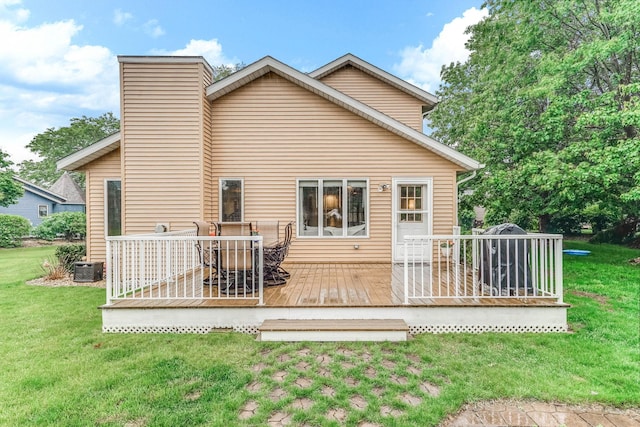 38 Jefferson Ct, Hastings, MN 55033 - back of property with a deck, a yard, and a chimney