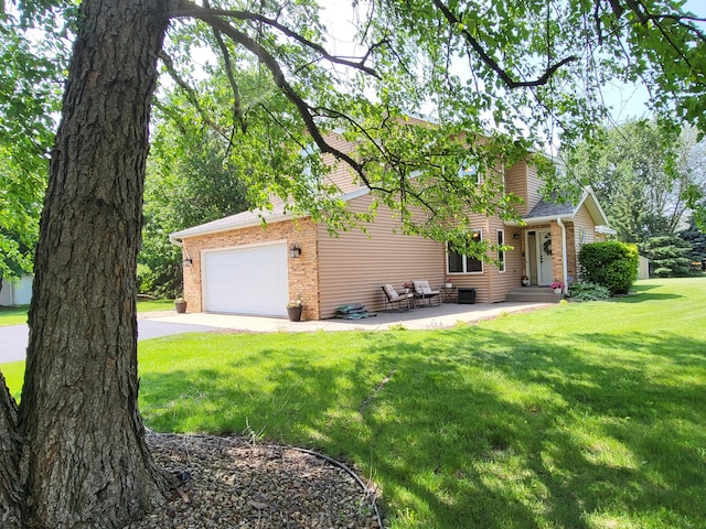38 Jefferson Ct, Hastings, MN 55033 - view of front of property with an attached garage, driveway, a front yard, and brick siding