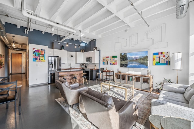 111 Franklin Ave Unit 105, Minneapolis, MN 55404 - living room with finished concrete floors and a high ceiling