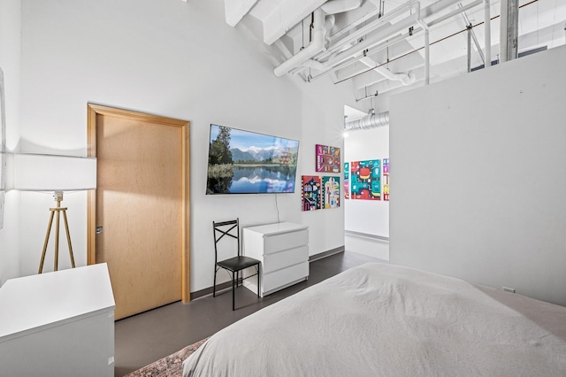 111 Franklin Ave Unit 105, Minneapolis, MN 55404 - bedroom featuring a towering ceiling and concrete flooring