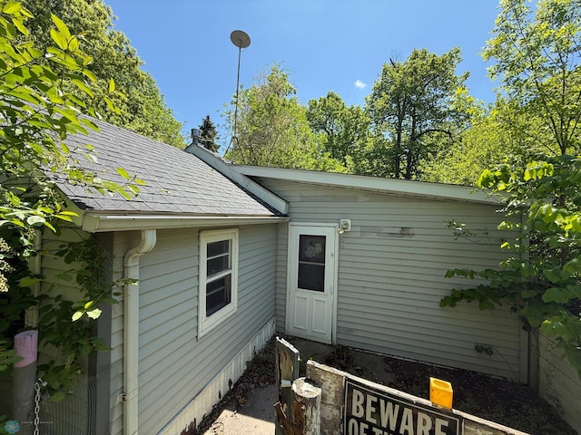 202 Main St Unit S, Ada, MN 56510 - view of side of home featuring a shingled roof