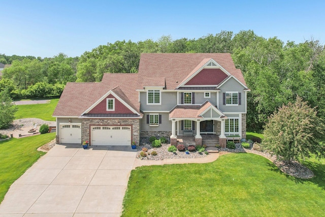 15758 Austin St NE, Ham Lake, MN 55304 - craftsman inspired home featuring stone siding, driveway, a porch, a garage, and a front yard