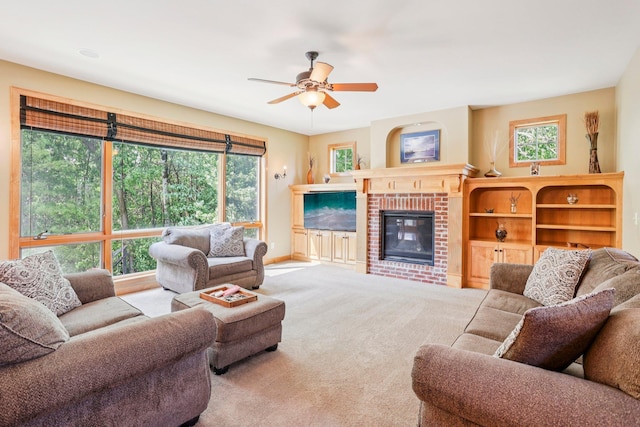 15758 Austin St NE, Ham Lake, MN 55304 - carpeted living room with a ceiling fan and a brick fireplace